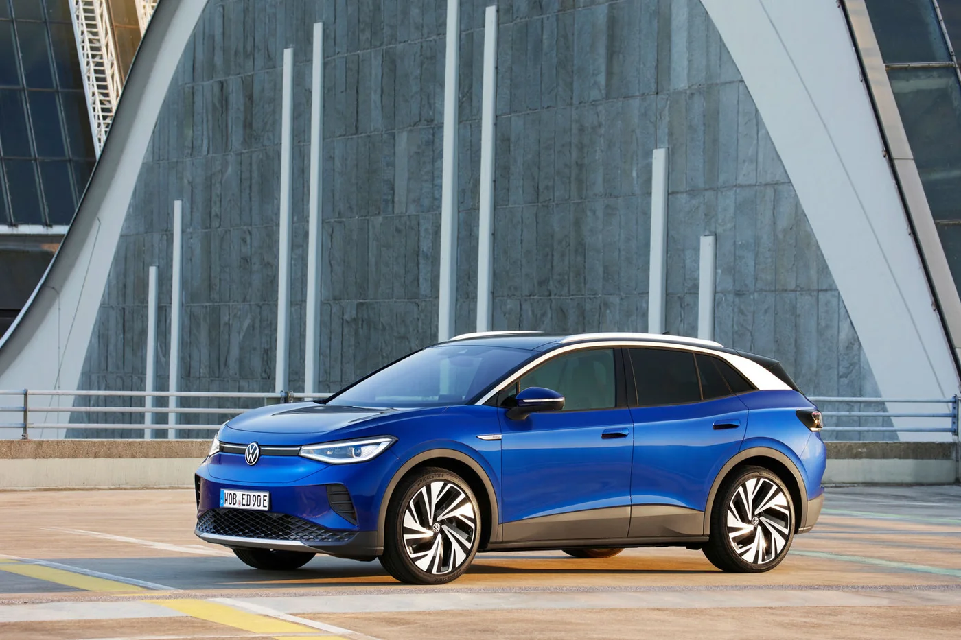 Blue Volkswagen ID.4 parked, front three-quarter view