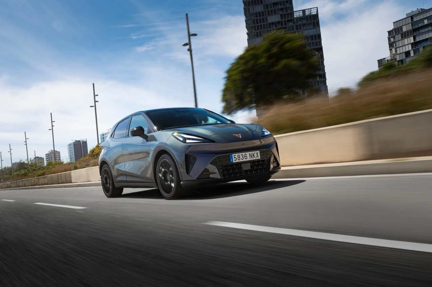 Cupra Raval driving, front three-quarter view
