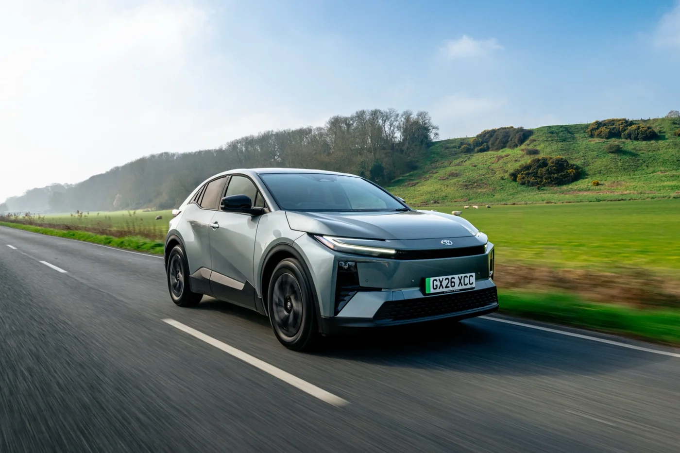 Toyota C-HR+ driving on a country road