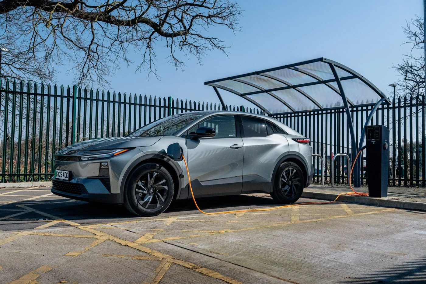 Toyota C-HR+ plugged in at a public charging point